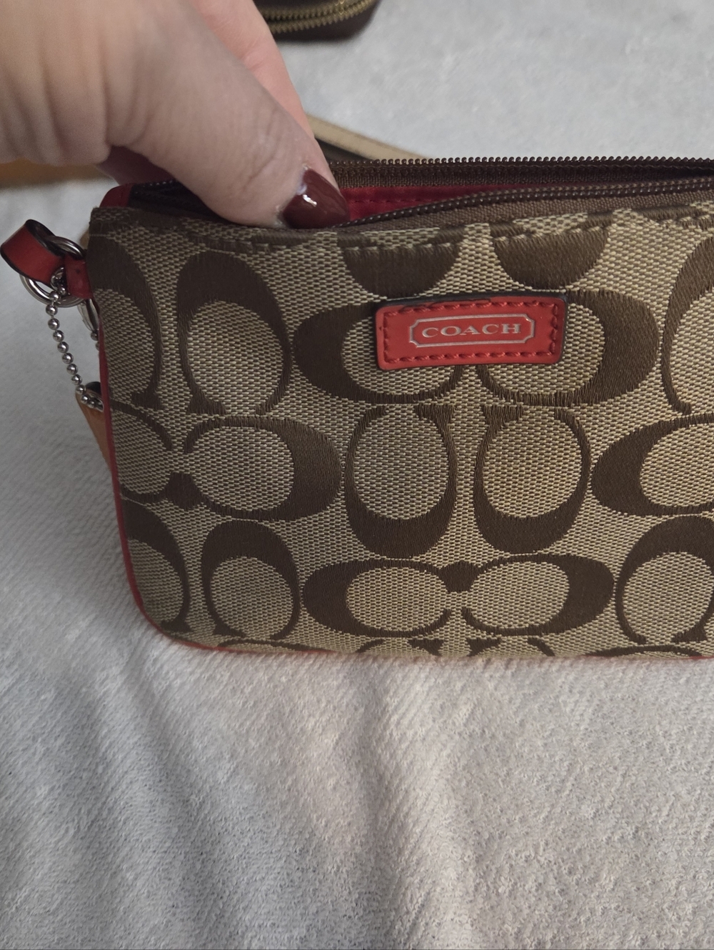 COACH Brown Signature Canvas Wristlet with Red Trim